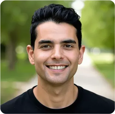 Smiling young man portrait outdoors with green background