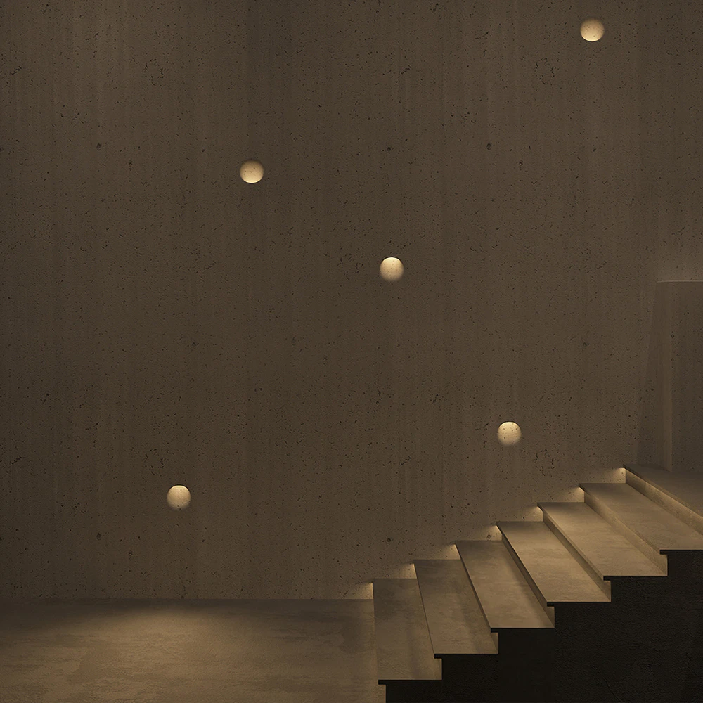 Trimless gypsum LED step lights installed on interior staircase wall creating soft ambient and safety lighting